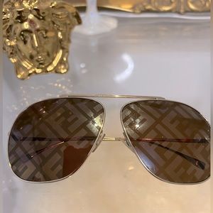 FENDI….aviator sunglasses in brown with logo lenses.